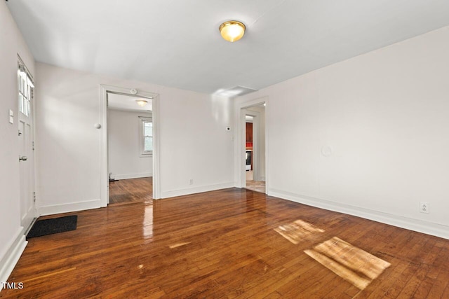 empty room featuring hardwood / wood-style flooring