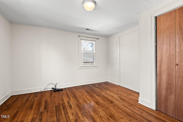 unfurnished bedroom featuring hardwood / wood-style flooring