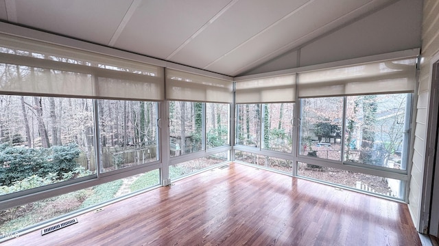 unfurnished sunroom with vaulted ceiling