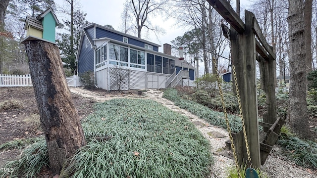 view of yard featuring a sunroom