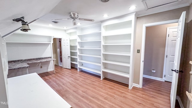 walk in closet with hardwood / wood-style flooring and ceiling fan