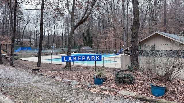 view of pool with a water slide