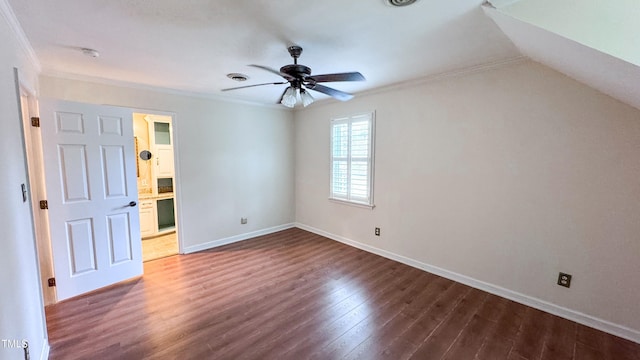 interior space featuring ornamental molding, dark hardwood / wood-style floors, ceiling fan, and ensuite bath