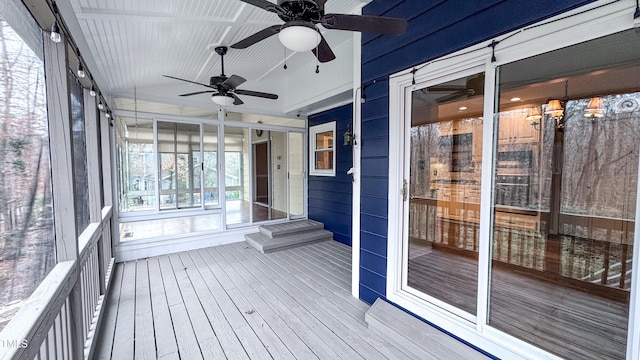 unfurnished sunroom featuring vaulted ceiling and ceiling fan