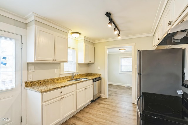 kitchen featuring stainless steel appliances, white cabinetry, sink, and light stone counters