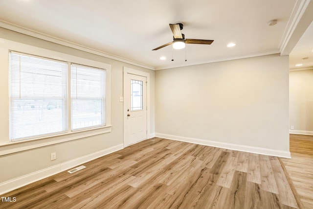 interior space with ornamental molding, light hardwood / wood-style floors, and ceiling fan