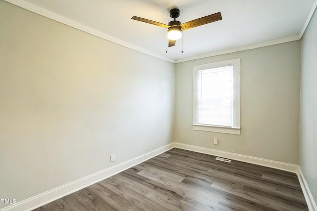 unfurnished room featuring ceiling fan, ornamental molding, and hardwood / wood-style floors