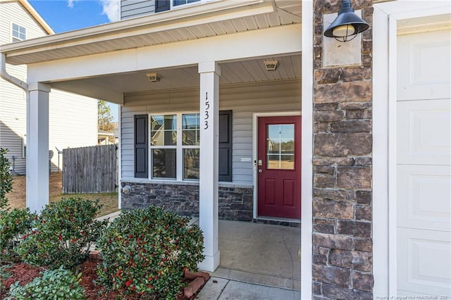 doorway to property featuring covered porch