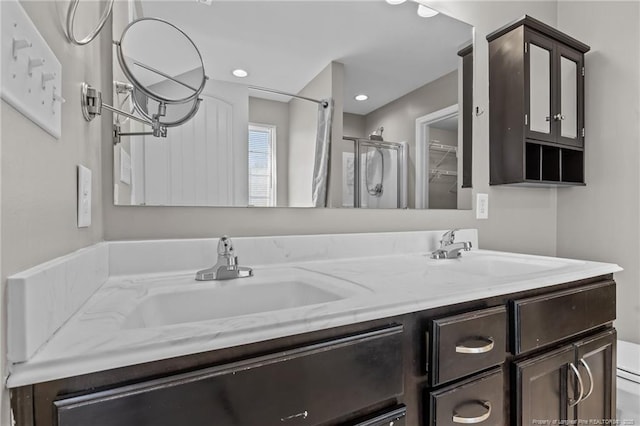 bathroom featuring vanity and walk in shower