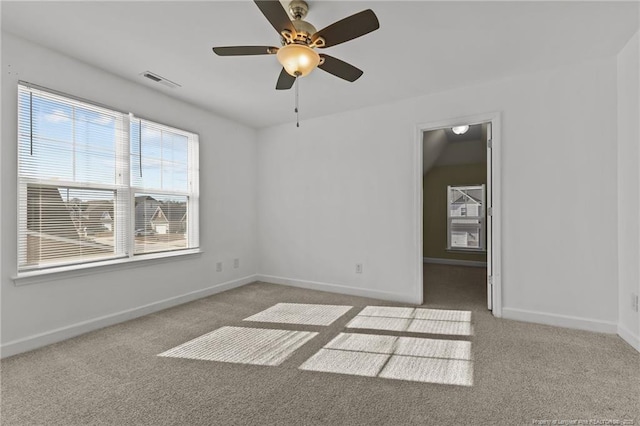 carpeted empty room featuring ceiling fan