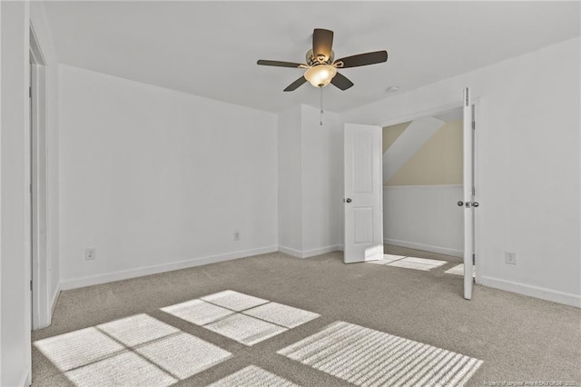 unfurnished bedroom featuring ceiling fan and light colored carpet