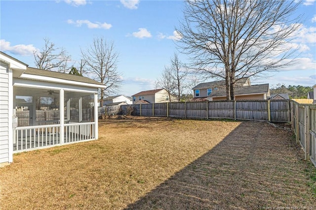 view of yard featuring a sunroom