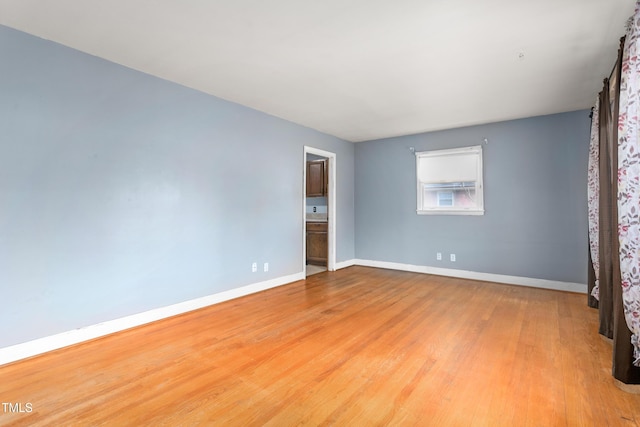 spare room featuring light hardwood / wood-style floors