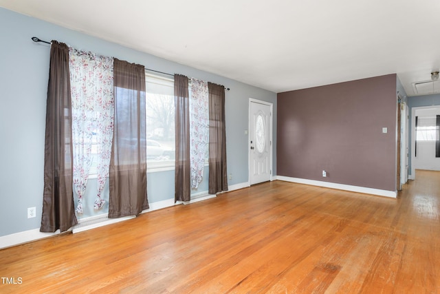 spare room featuring hardwood / wood-style floors