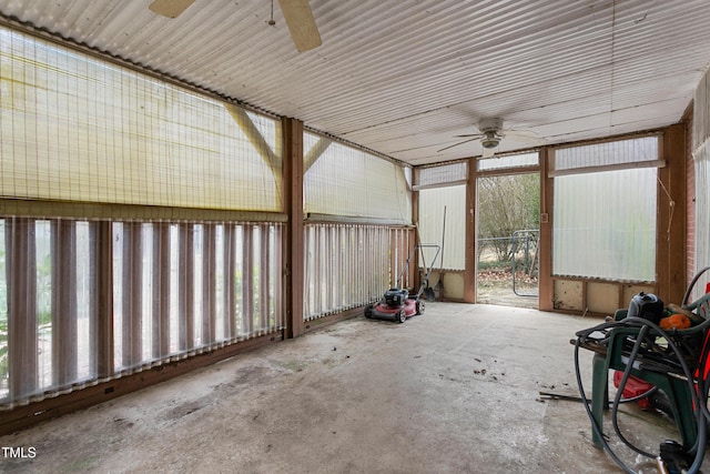 unfurnished sunroom with ceiling fan