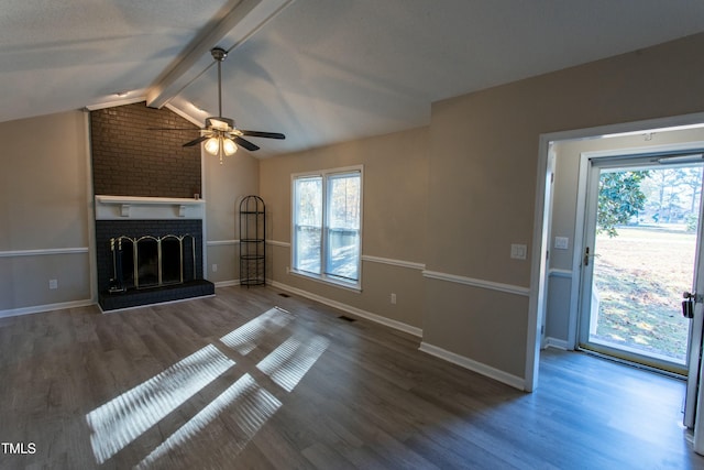 unfurnished living room featuring wood-type flooring, vaulted ceiling with beams, ceiling fan, and a fireplace