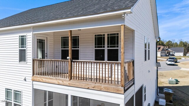 back of house with a balcony