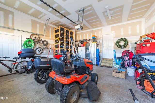 garage featuring a garage door opener and stainless steel refrigerator with ice dispenser