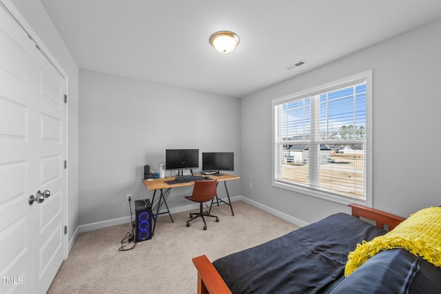 bedroom with light colored carpet