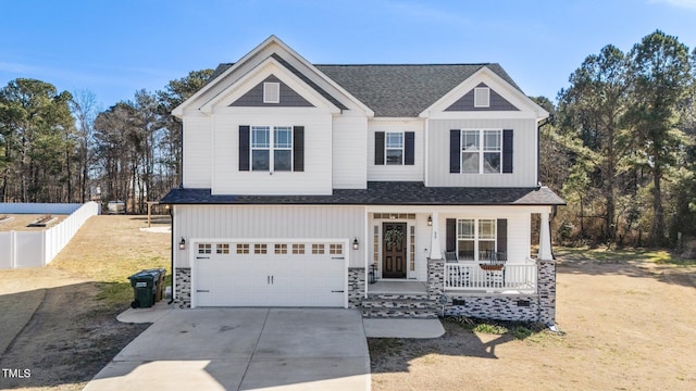 view of front of property featuring a garage and covered porch