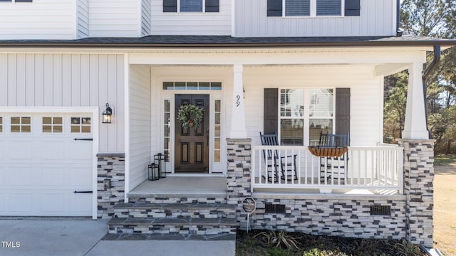 property entrance with a porch and a garage