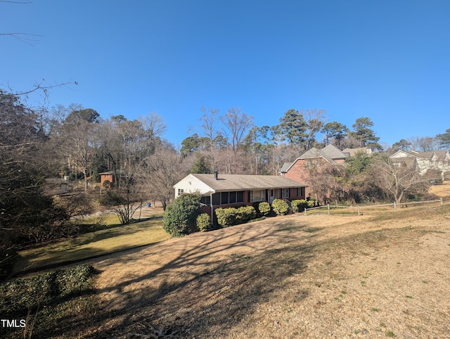 view of yard with a sunroom