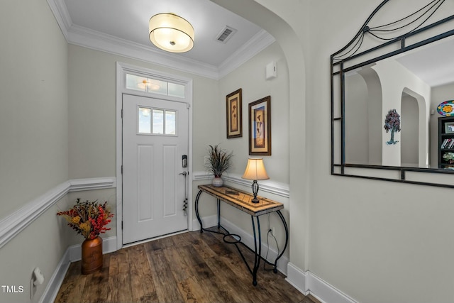 entrance foyer featuring baseboards, visible vents, dark wood-type flooring, and ornamental molding