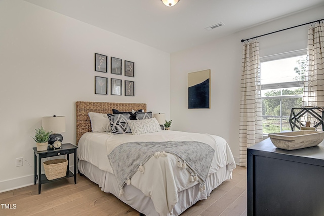 bedroom with light hardwood / wood-style floors