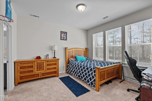 carpeted bedroom with visible vents