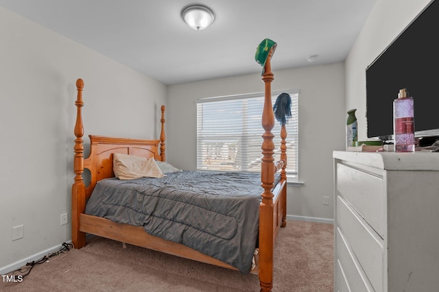 bedroom featuring carpet floors and baseboards