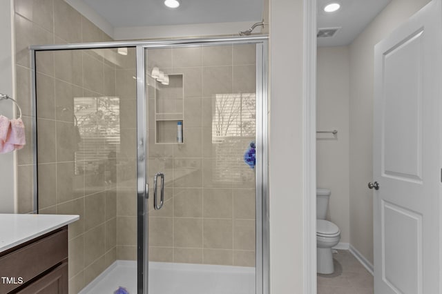 full bath with tile patterned flooring, toilet, visible vents, vanity, and a stall shower