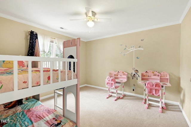 carpeted bedroom with ornamental molding and ceiling fan