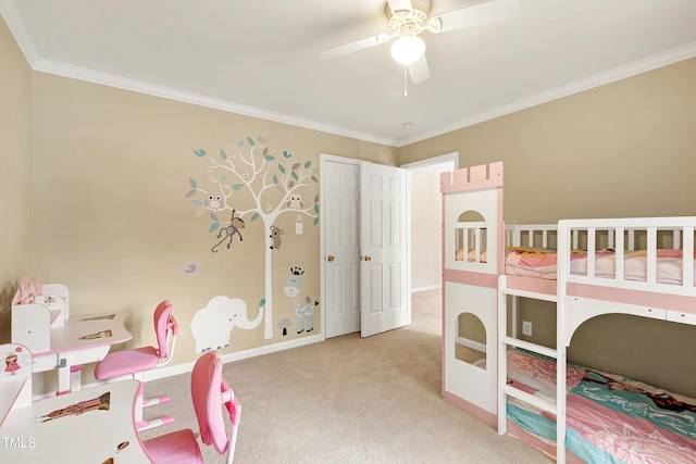 bedroom with ornamental molding, ceiling fan, and carpet flooring