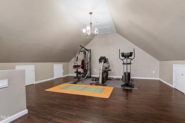 exercise area featuring lofted ceiling, a notable chandelier, and dark wood-type flooring