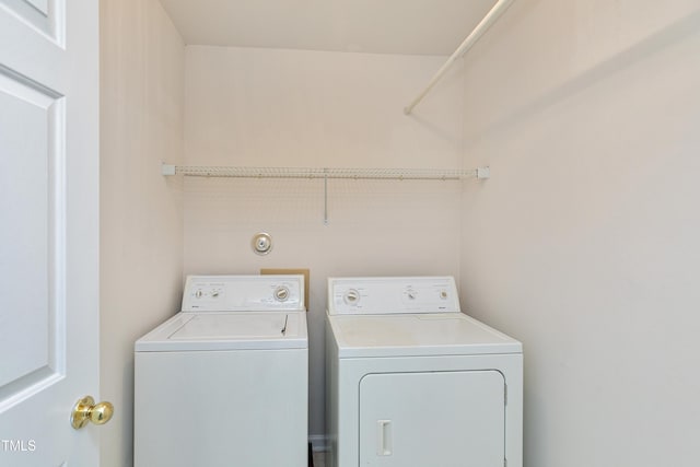 laundry room with independent washer and dryer