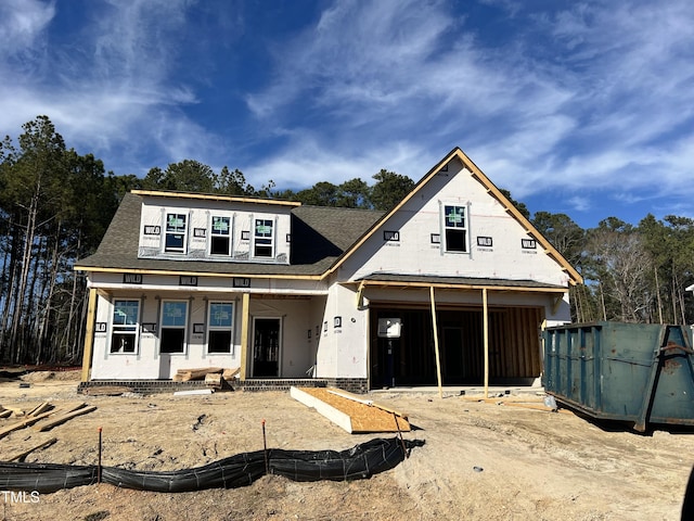 property under construction featuring a shingled roof