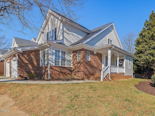 view of front of property with a garage and a front lawn