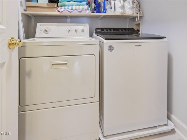 laundry area with washing machine and dryer