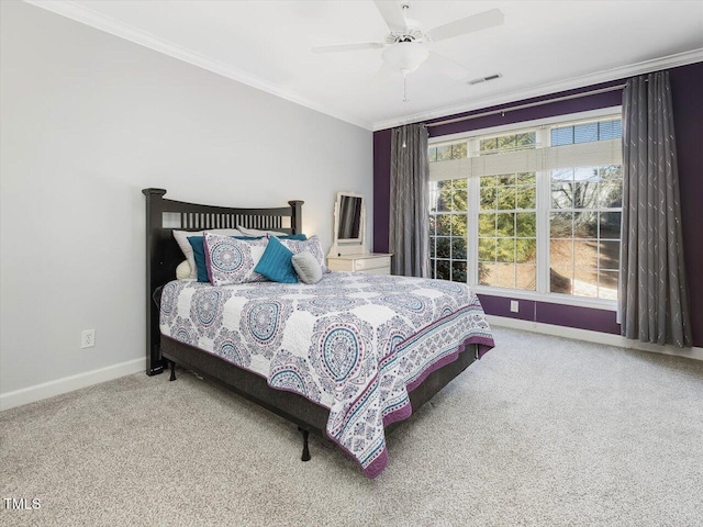 bedroom with crown molding, carpet, and ceiling fan