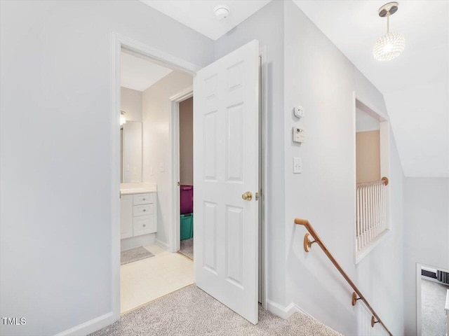 hallway with light carpet