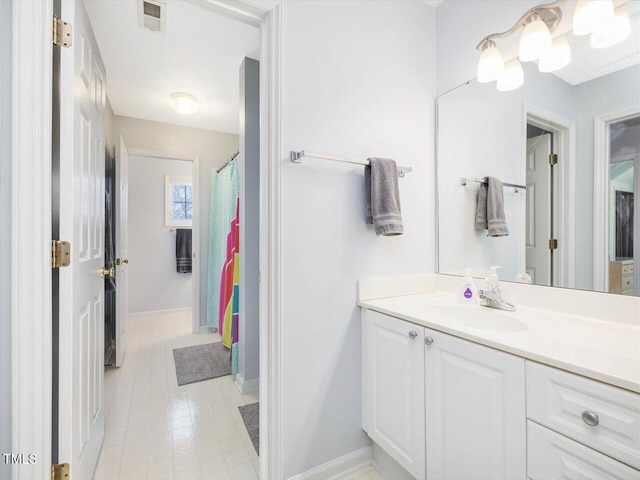 bathroom with vanity and curtained shower