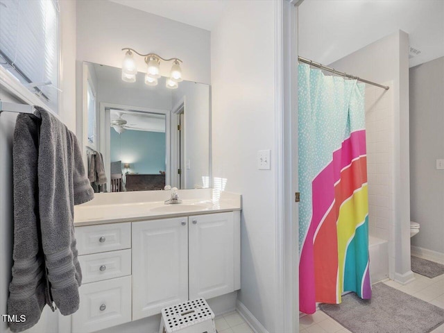 full bathroom featuring vanity, shower / bath combo, and toilet