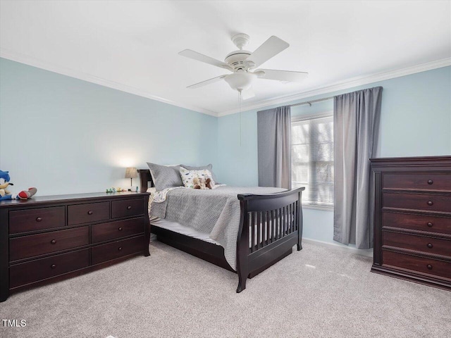 bedroom featuring crown molding, light colored carpet, and ceiling fan