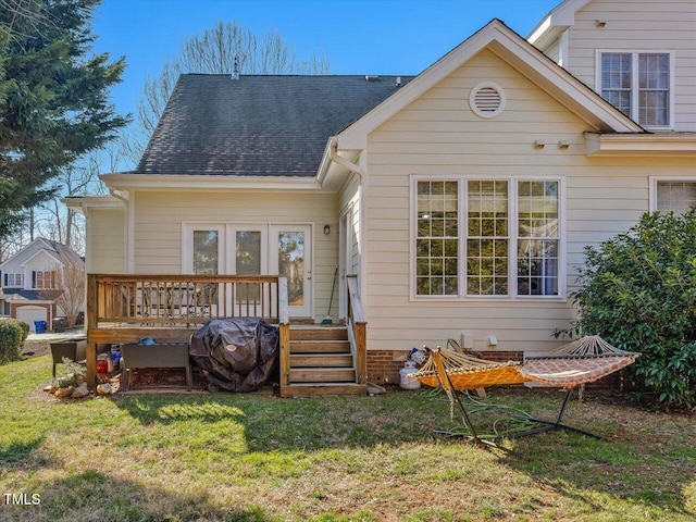 back of property featuring a yard and a deck