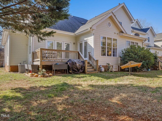 rear view of house with central AC, a lawn, french doors, and a deck