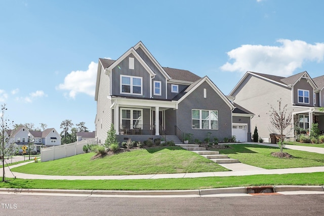 craftsman inspired home with a porch, a garage, and a front yard