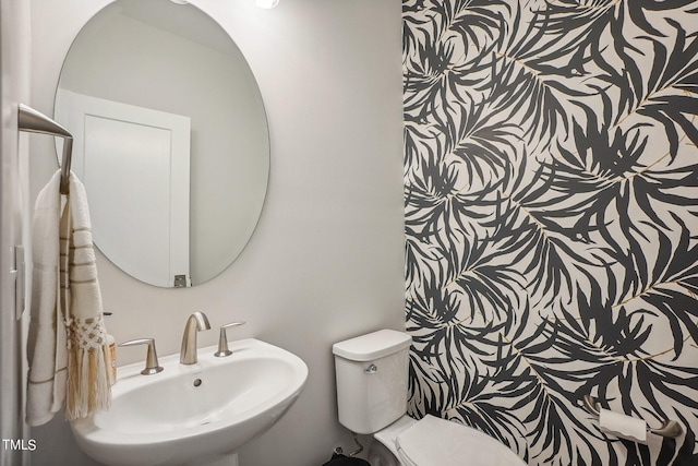 bathroom with sink and toilet