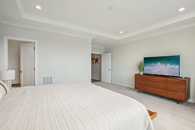 bedroom featuring light carpet, crown molding, and a raised ceiling