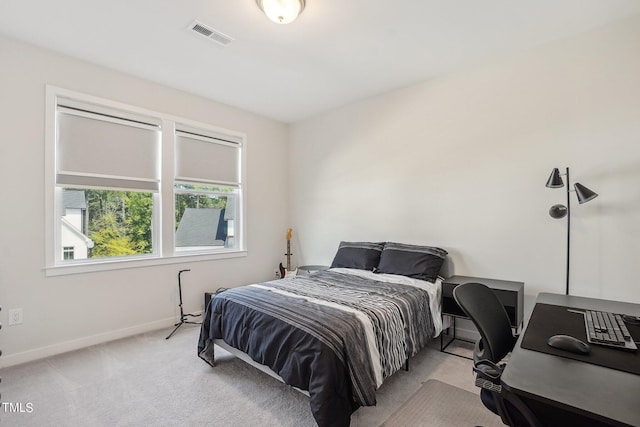 bedroom featuring light colored carpet