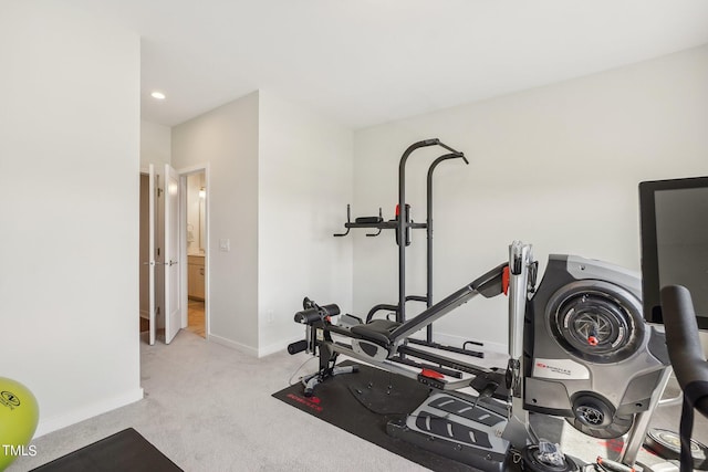 exercise room with light carpet